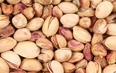 Close up of many pistachios.