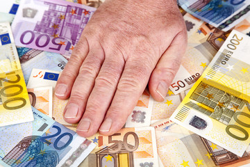 Hand holding paper money