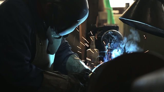 Welder welding a steel spiral