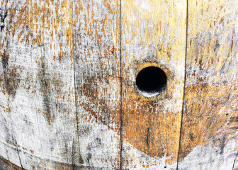 old wine barrel with hole