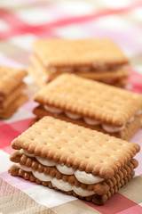 Sandwich cookies on pink tablecloth