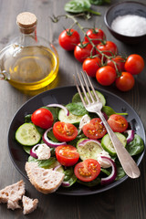 salad with tomatoes cucumber and goat cheese