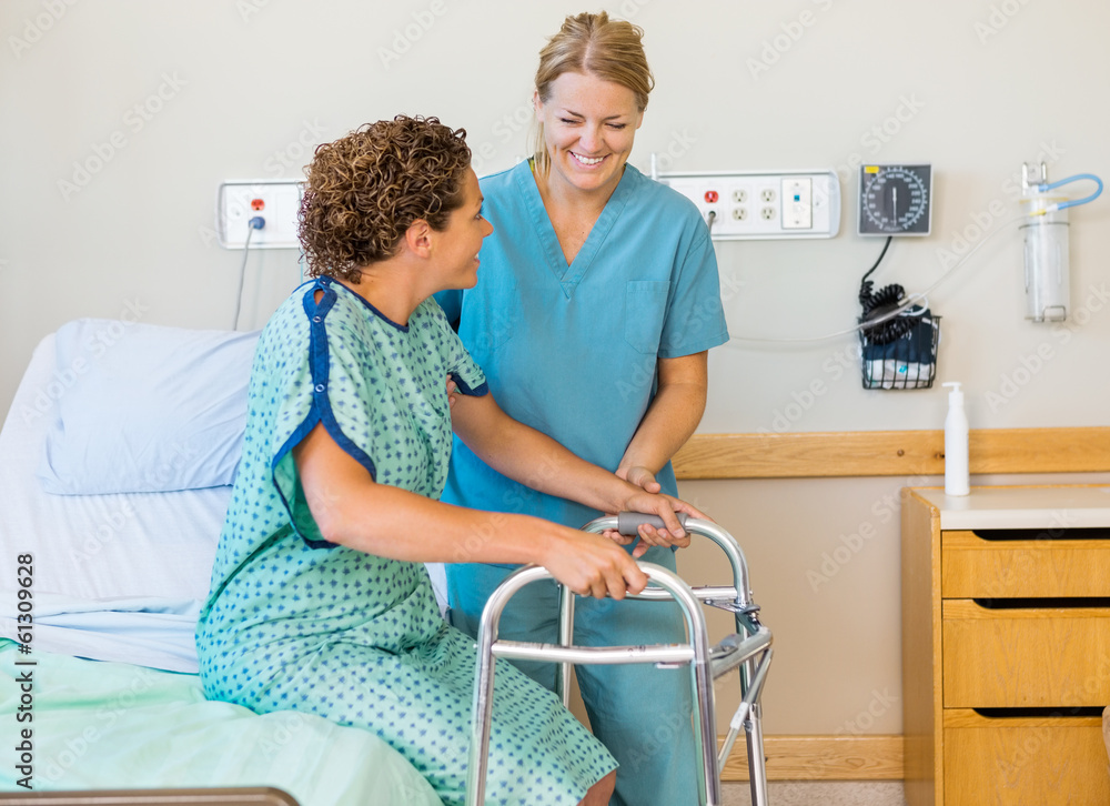 Wall mural nurse assisting patient using walking frame in hospital