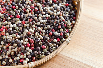 peppercorns on wooden table