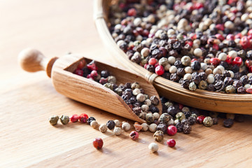 peppercorns on wooden table