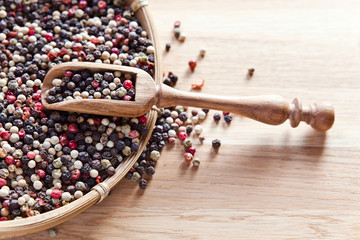 peppercorns on wooden table