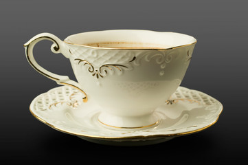 fine porcelain cup and saucer with coffee