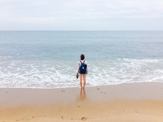 Girl alone on a beach