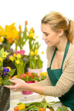 Florist arrange spring flowers colorful
