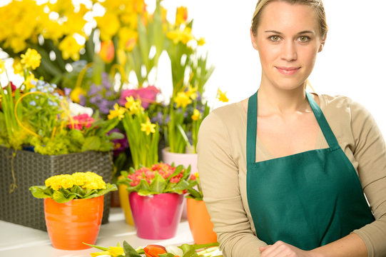 Florist with spring potted flowers