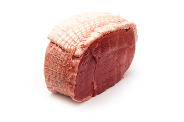 Topside of beef joint isolated on a white studio background.