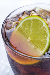 Fresh cocktail with cola drink and lime