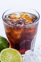 Fresh cocktail with cola drink and lime