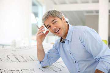 Portrait of smiling architect working in office