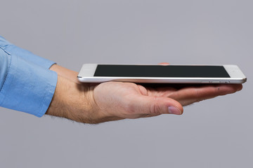 White tablet pc in hands