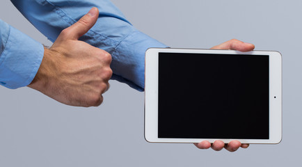 White tablet pc in hands