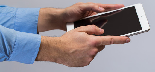 White tablet pc in hands