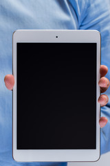 White tablet pc in hands
