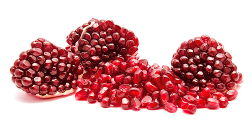 Ripe pomegranate fruit seeds isolated on a white