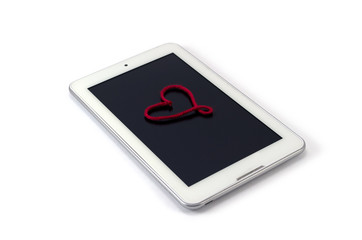 white  tablet with heart