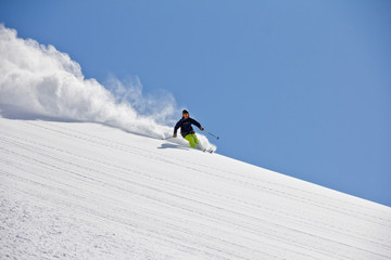 Skier in deep powder, extreme freeride