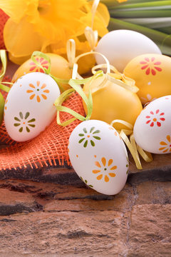 easter eggs with dots and yellow spring flower decoration