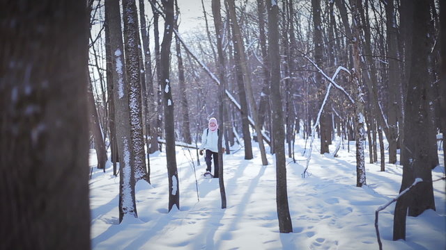 Lonely Woman Snowshoeing in nature