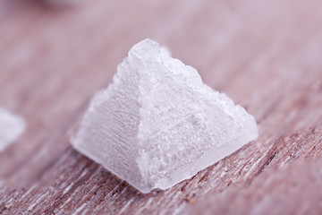 pyramid salt on wooden background