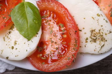 caprese salad with mozzarella, basil and tomatoes. macro