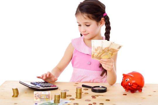Girl at the table counts money