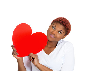 Happy woman in love, holding big red heart
