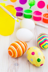 Fototapeta na wymiar Easter eggs and process of painting eggs