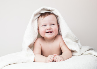 laughing baby on sofa, Beautiful smiling cute baby, newborn - 61329878
