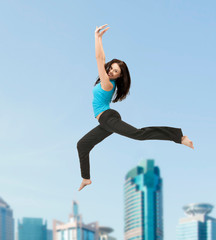 Fototapeta na wymiar sporty woman jumping in sportswear