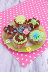 Tasty cupcakes with butter cream,