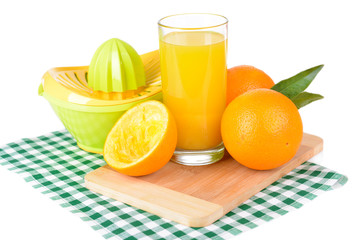 Citrus press and oranges isolated on white