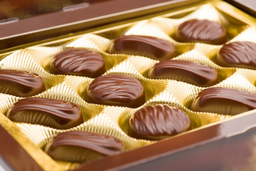 Delicious chocolate pralines in the golden box