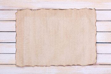 Old paper on wooden background