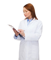 smiling female doctor with clipboard