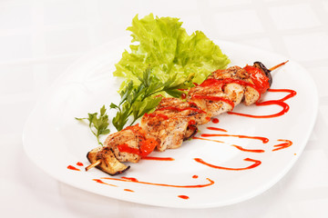Chicken kebab with tomato sauce