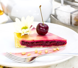 piece of cherry pie on a table in a restaurant