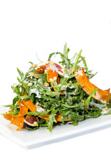 salad of arugula figs and cheese on white background