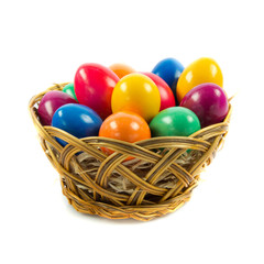 easter eggs in busket on green gras isolated