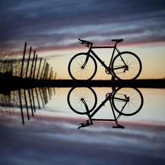 silhouette of race bike in sunset