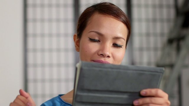 asian girl using touch pad device