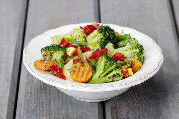 Fresh vegetable salad in ceramic bowl