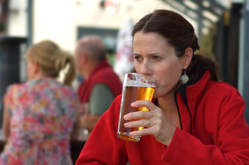 Woman drinks beer