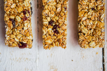 Granola bars on wooden background