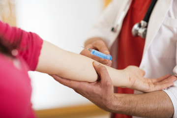 Pregnant woman with doctor