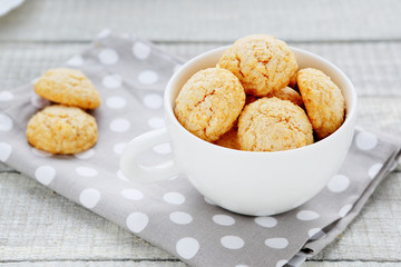 almond cookies, a cup of white amarettini